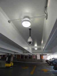 Parking garage lighting and CCTV surveillance camera.